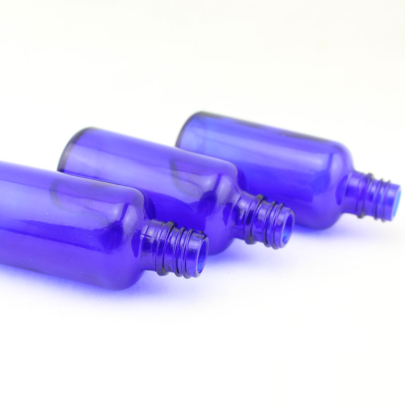 Buy 50ml empty round blue essential oil glass bottle