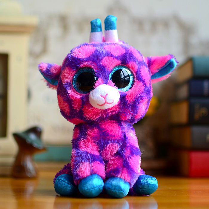 purple stuffed animal giraffe