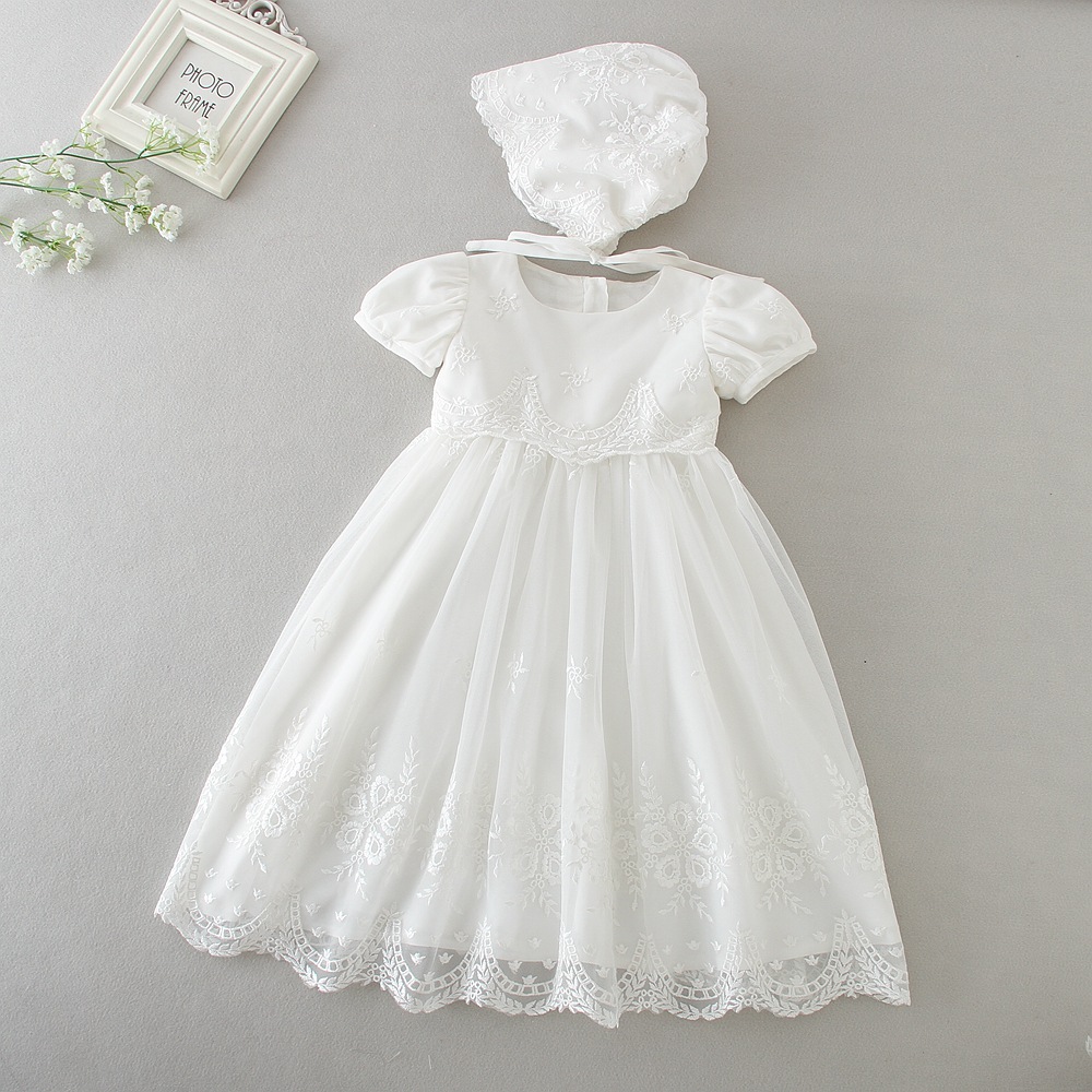 baby in white dress