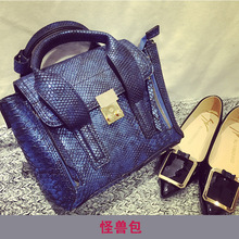 2015 European American swing wings leather handbags messenger bags diagonal small satchel simple bat smiley little monster